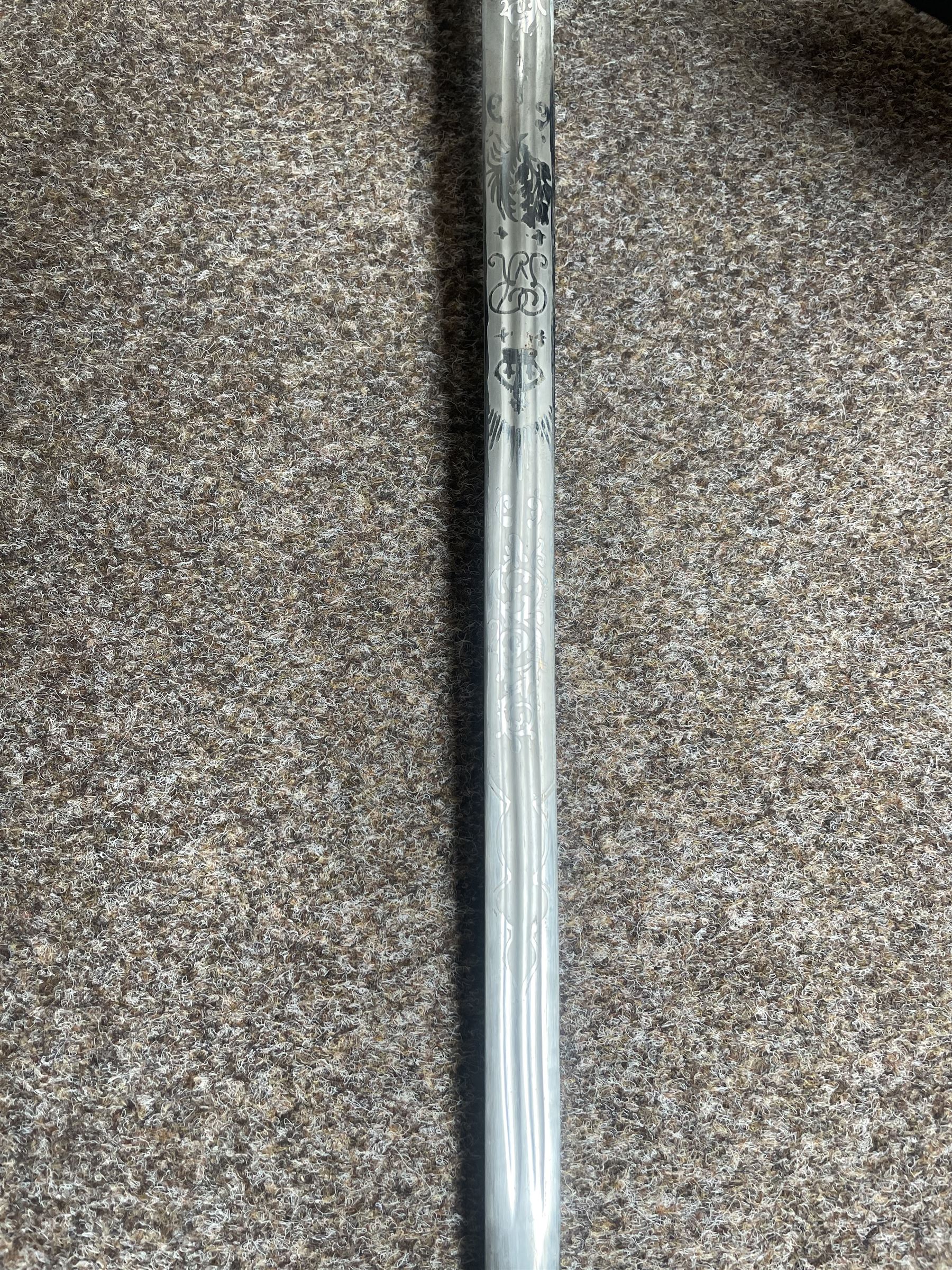 George V basket hilted broad sword with engraved blade, wire wound fish skin grip and field service scabbard, blade length 83cm