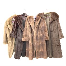 Four ladies three quarter length fur coats, by Dysons Furriers Ltd, Commercial St, Leeds, comprising of a light brown mink fur coat, two dark brown mink fur coats and another brown fur coat.  
