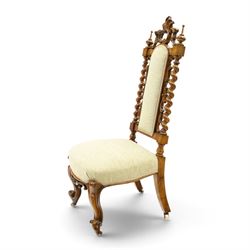 Victorian carved walnut side chair, the ornate high back with pierced and carved scrolled cartouche cresting rail, the back panel and sprung seat upholstered in sage green fabric, flanked by scrolling acanthus leaves and spiral turned pilasters, raised on scroll carved cabriole legs with ceramic castors