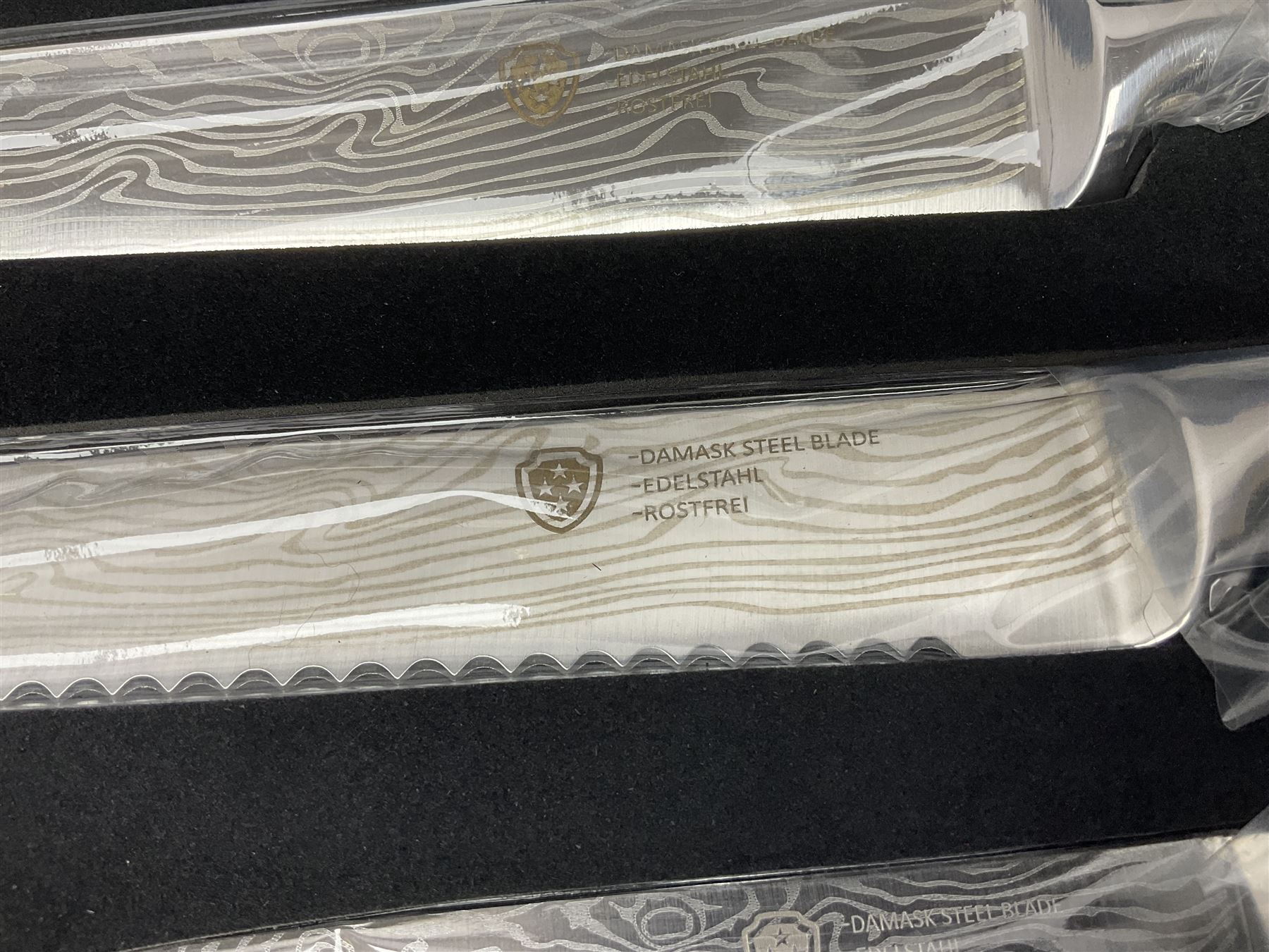 Two cased Swiss knife sets