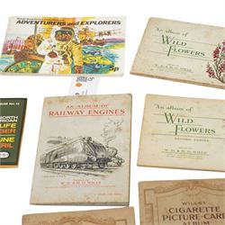 Seven albums of Wills cigarette cards including Wild Flowers, Railway Engines etc., Carreras Birds of the Countryside and five trade card albums