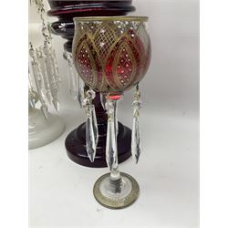 Bohemian red glass lustre, painted with stylised floral and foliate decoration, together with a milk glass example and two bohemian goblets converted to lustres 