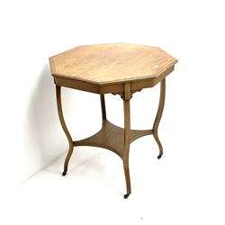 Early 20th century mahogany cross banded and inlaid octagonal centre table, shaped supports joined by undertier