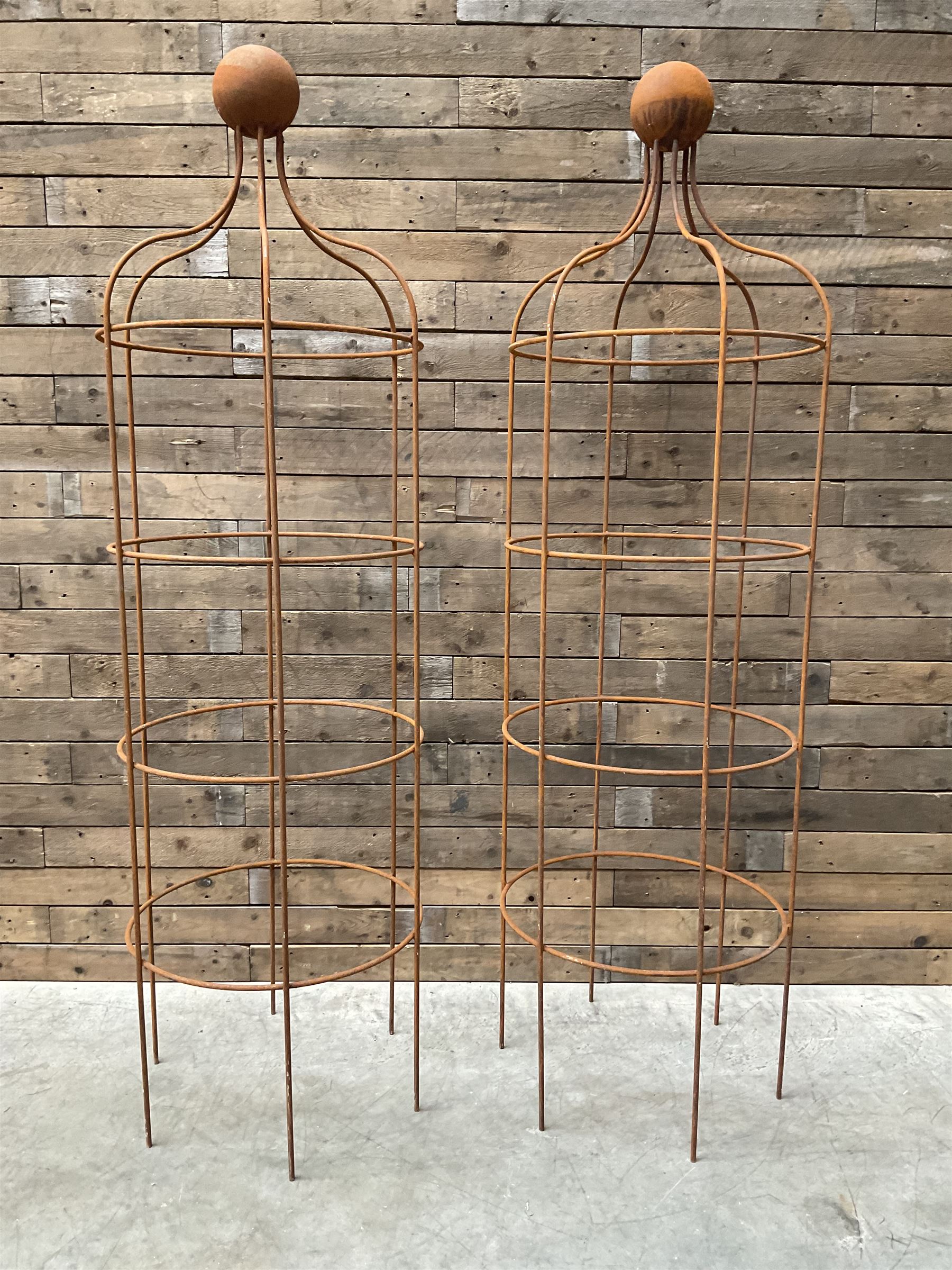 Pair of Country House wrought iron garden obelisks with ball finial, raise in four tiers