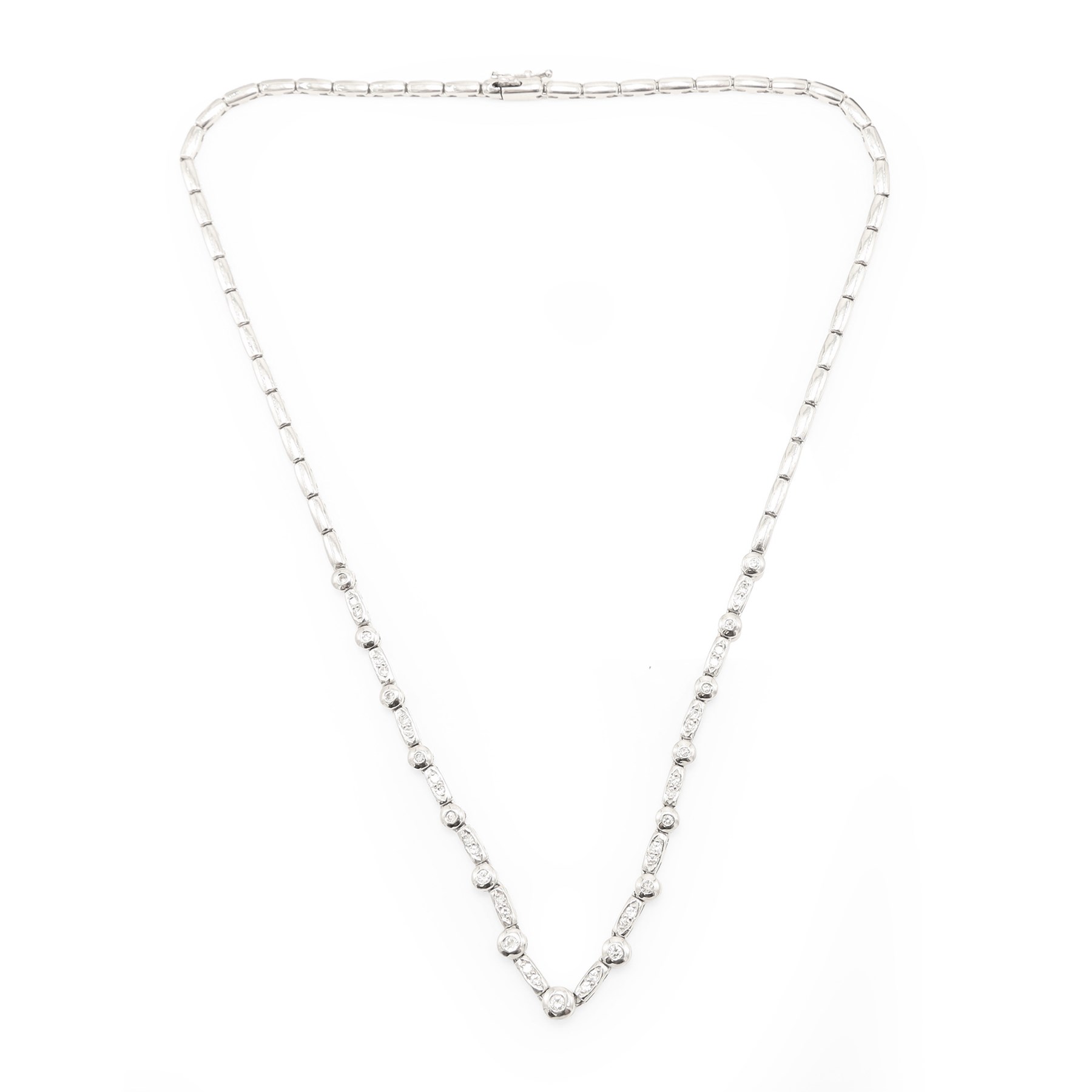 18ct white gold diamond necklace, bezel set with a single round brilliant cut diamond, spaced by two further diamonds, to a rectangular link necklace, London 2000, total diamond weight approx 0.75 carat