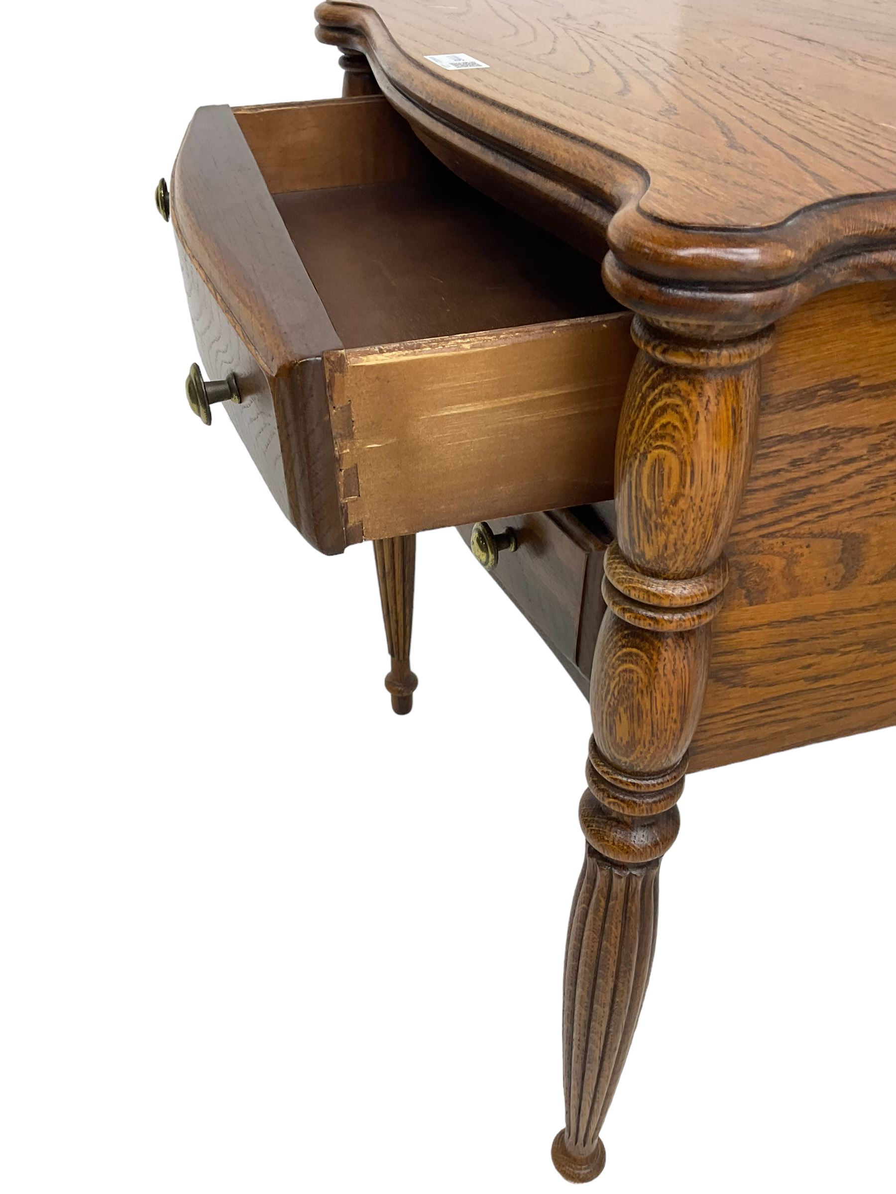 Lexington Furniture - pair of oak bedside lamp tables, shaped moulded top over two drawers, on turned and reed moulded supports