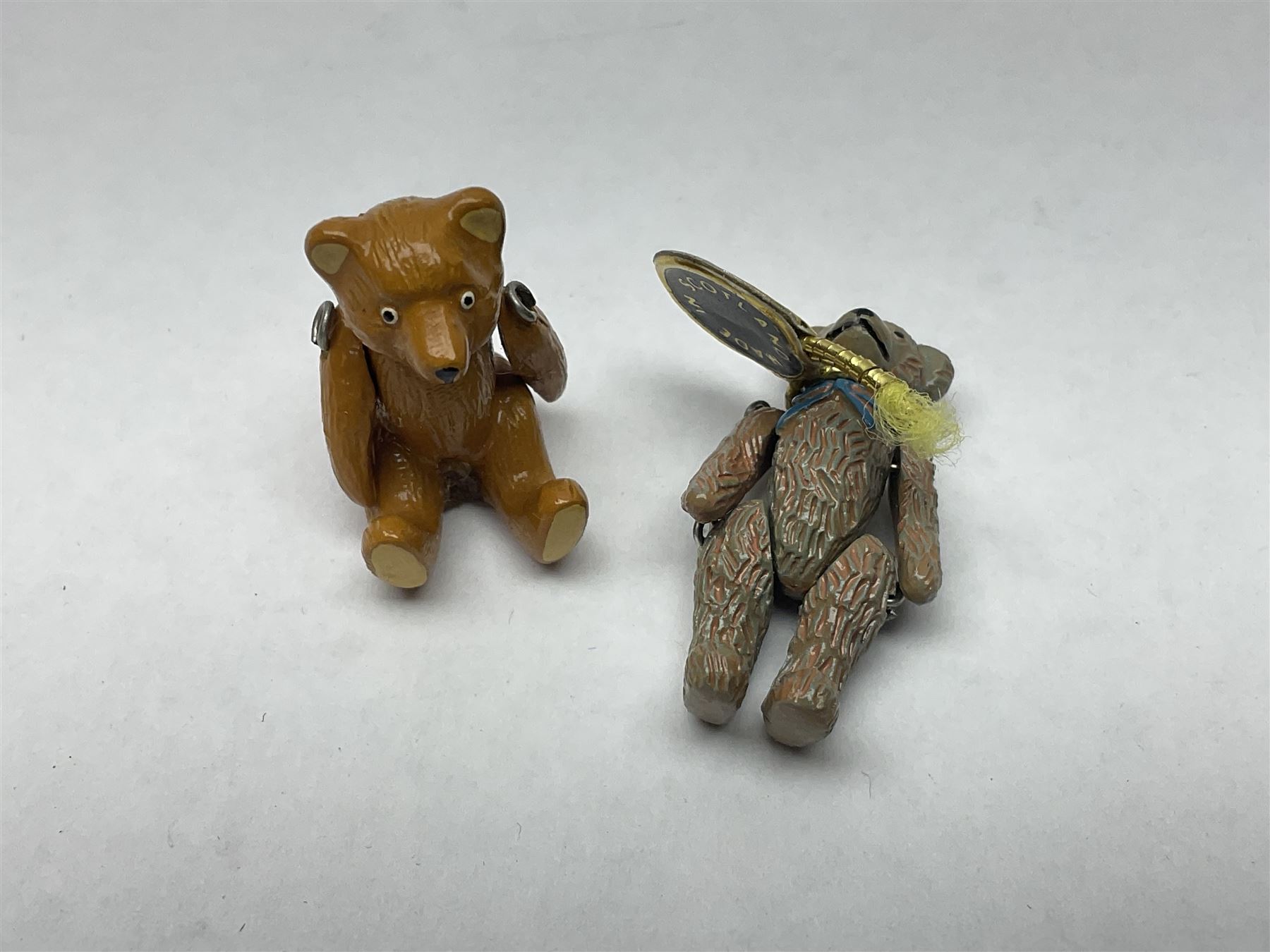 Seven Hantel miniature articulated pewter teddy bears, including bride and groom 