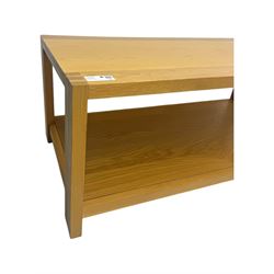 Light oak rectangular coffee table, with exposed finger joints to the corners, raised above a full-length undertier on straight supports
