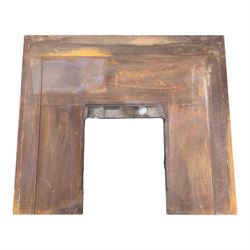 Two cast iron fire surrounds / inserts along with four metal surround pieces 