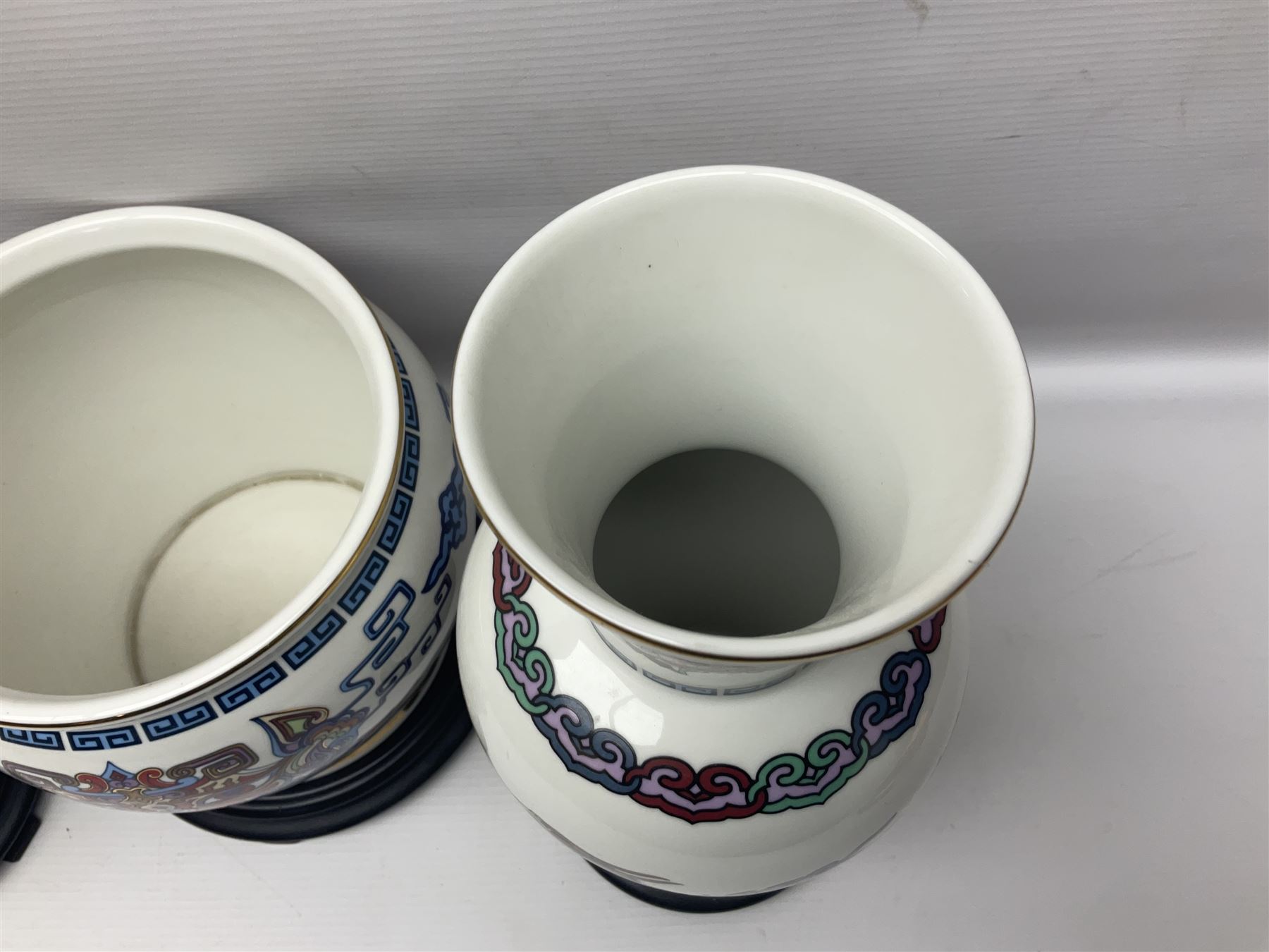 Franklin Mint Chinese style ceramics, comprising two vases, puppy and a planter, all on wooden stands