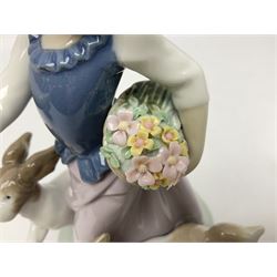 Three Lladro figures, comprising Out for a Romp, no 5761, Aracely with Ducks, no 5202, and Hello, Flowers, no 5543, all with original boxes, largest example H25cm