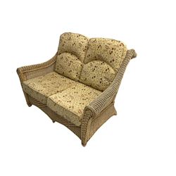 Four piece cane conservatory suite - two seat sofa (W130cm), pair of armchairs (W85cm), and coffee table (85cm x 60cm)