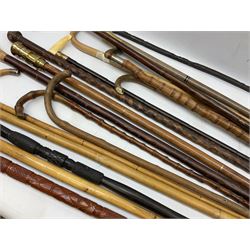 Collection of walking sticks and canes to include 19th/ early 20th century vertebrae example with whale tooth grip, Victorian and later hallmarked silver handled examples, swagger sticks etc 