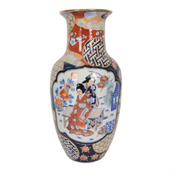 Pair of Japaneses imari vases, the central panel, decorated with figures in a landscape, together with famille rose vase, largest H37cm  