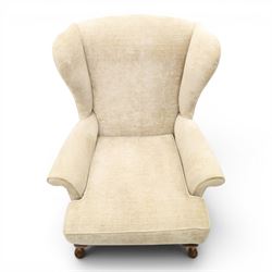 Parker Knoll - 'Hartley' lounge suite, comprising three wingback armchairs and two-seat settee, upholstered in cream fabric, shaped wing backs with scroll-over arms and loose seat cushions, on cabriole supports with pad feet wingbacks and settee

Armchairs: H 96cm, D 83cm, W 75cm