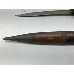 Burmese dha dagger with 15cm steel blade, white metal ferrule and horn handle, in white metal and filigree scabbard L30.5cm; a Burmese long bladed knife with horn handle and brass mounted teak scabbard; and another Eastern dagger in sheath (3)