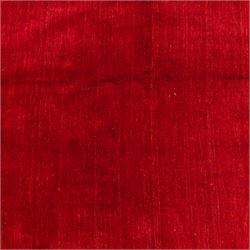 Indian hand-knotted wool Gebbeh design carpet, of rectangular form, woven in a rich madder red tone