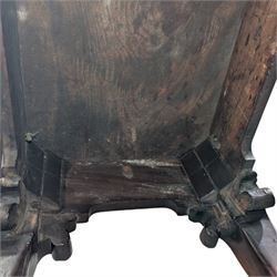 George I carved mahogany side table, adapted from a card table, the rectangular top with foliate-carved edge above a plain frieze, raised on cabriole legs with acanthus-carved knees, volute brackets and floral-carved motifs, terminating to ball-and-claw feet