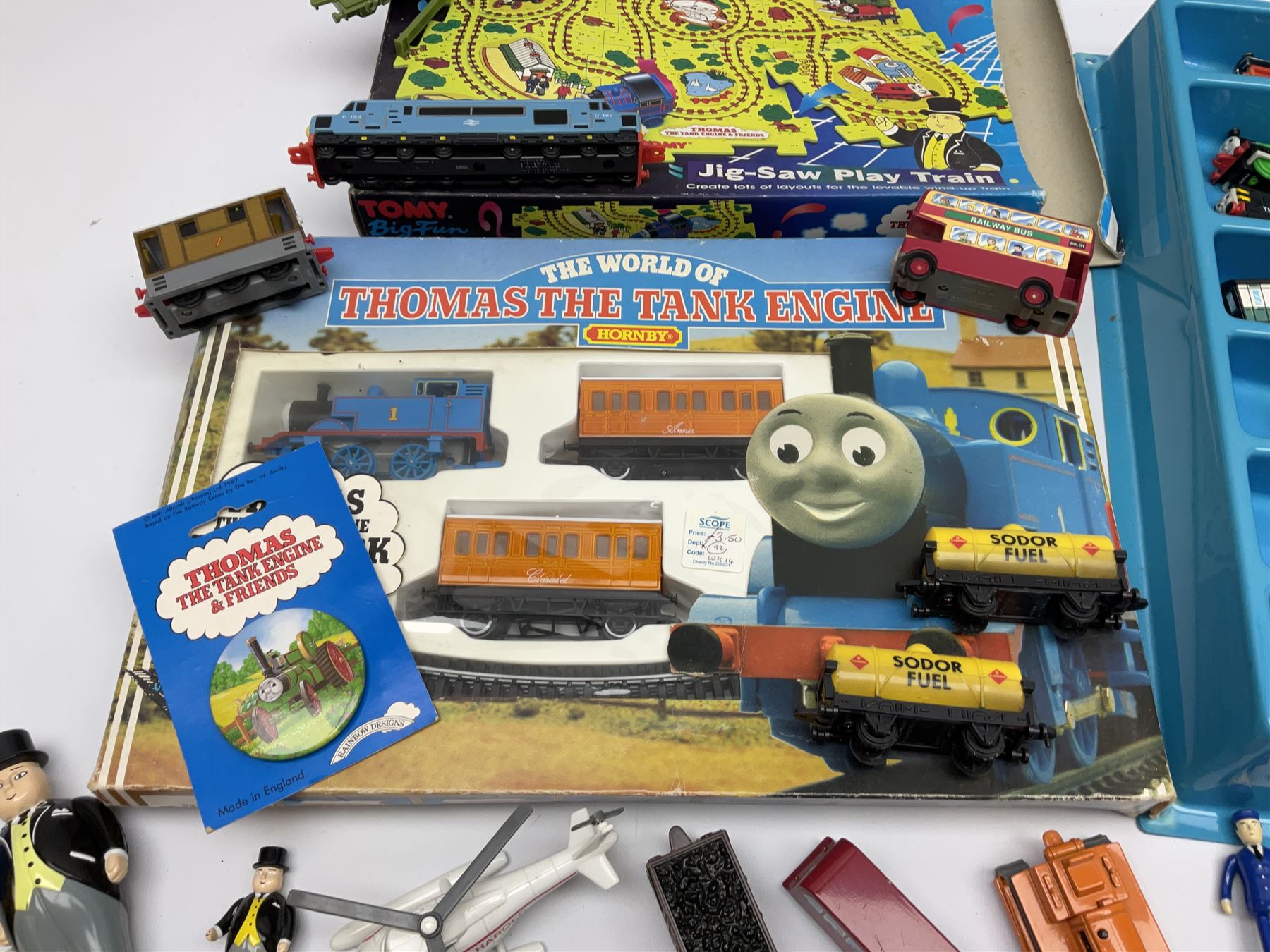 Thomas The Tank Engine and Friends - over forty unboxed models and figures by ERTL with moulded plastic wall mounting display rack; Hornby Clockwork Train Set; and Tomy Big Fun Jig-Saw Play Train; both boxed