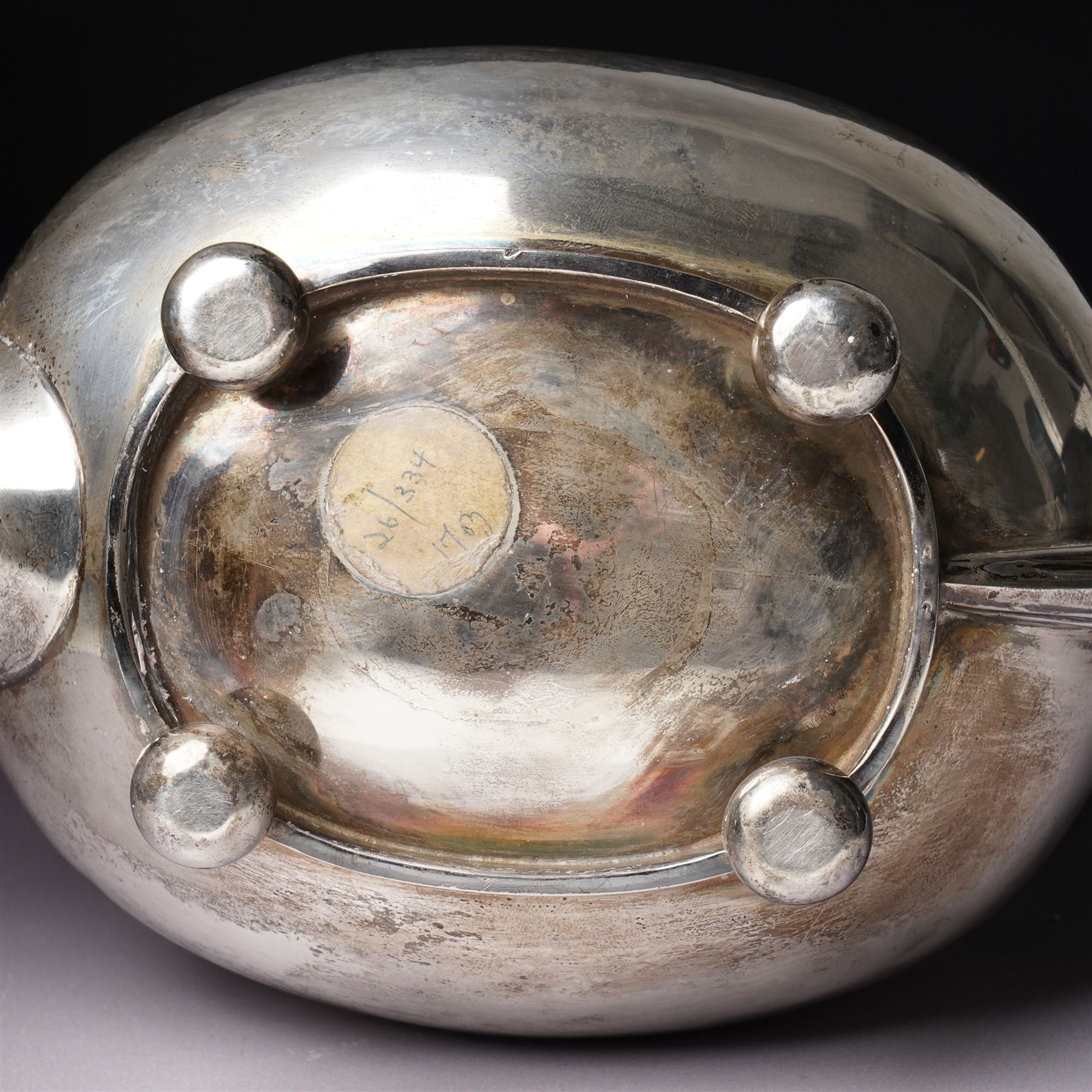 Silver tea pot of oval form with ebonised handle and lift on compressed bun feet Sheffield 1919 Maker Atkin Bros.