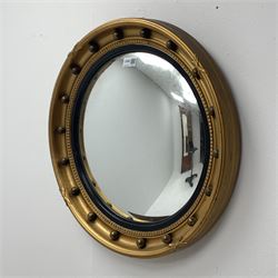 *20th century circular gilt wall mirror with convex glass, moulded black lacquered slip and mounted ball surround, D53cxm
