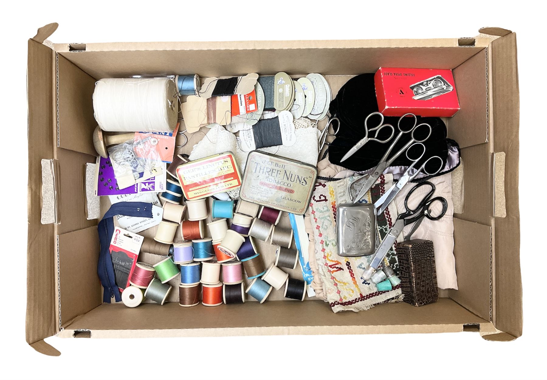  Victorian sampler worked with the alphabet by Carrie Monkman 1886, Victorian silver-plated cigarette case, Carlo simulated tortoiseshell motorised fan in case, Folding Opera Glasses, two chrome leaping Jaguar brooch and matching pin badge, quantity of sewing threads, lace etc