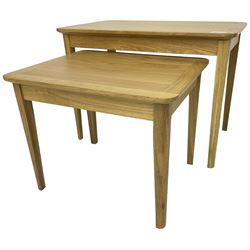 Contemporary light oak nest of two tables, rectangular top over tapering supports