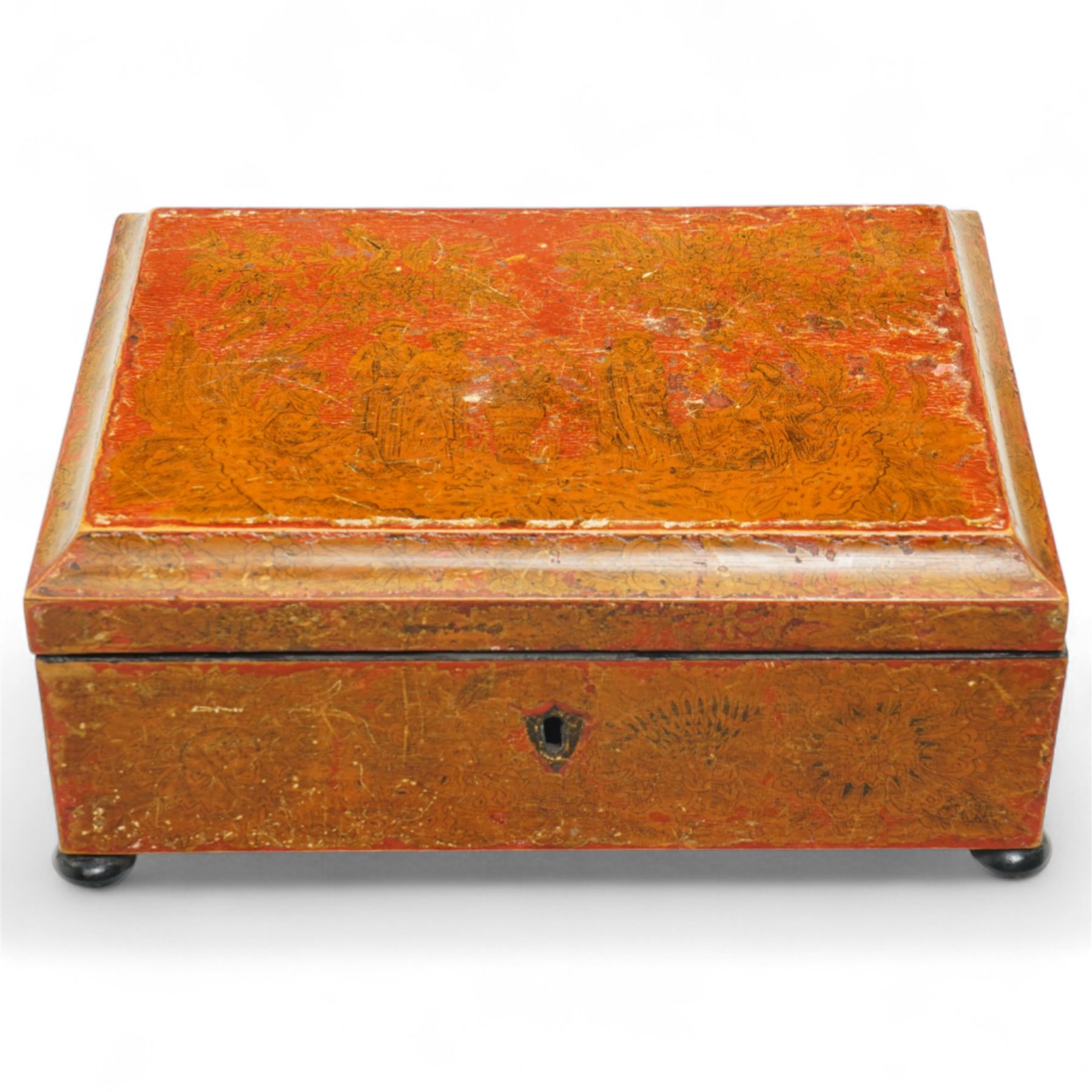 Regency red lacquered penwork box, of rectangular form on bun feet, decorated with classical figures in a landscape among foliate motifs, W28cm 