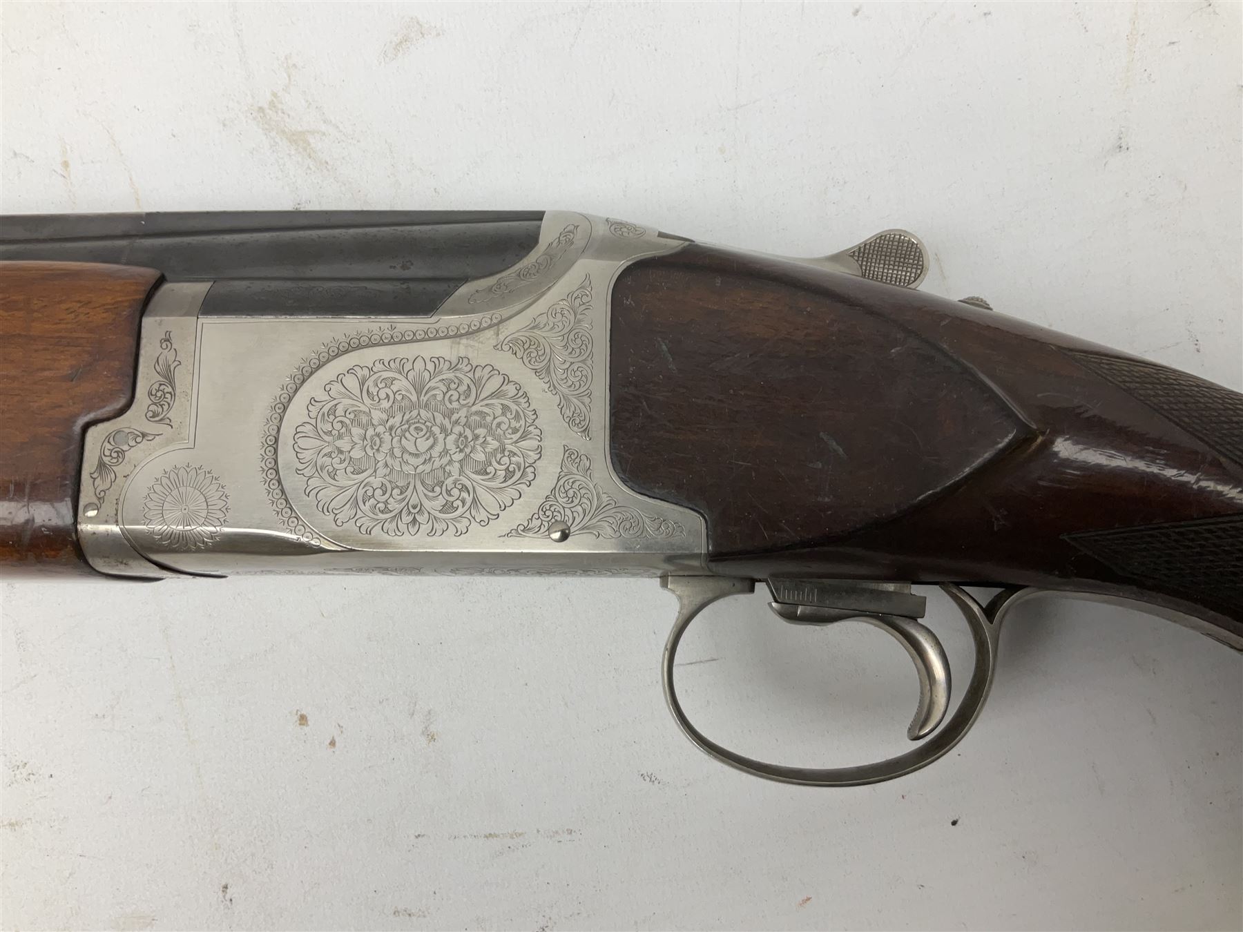 Winchester Japan 5500 12-bore by two-and-three quarters over-and-under double barrel boxlock ejector sporting gun, with 71cm barrels, ventilated rib and barrels, the walnut stock with chequered pistol grip and fore-end, single selective trigger and top safety, serial no.K542927E, L115cm overall; in gun sling SHOTGUN CERTIFICATE REQUIRED