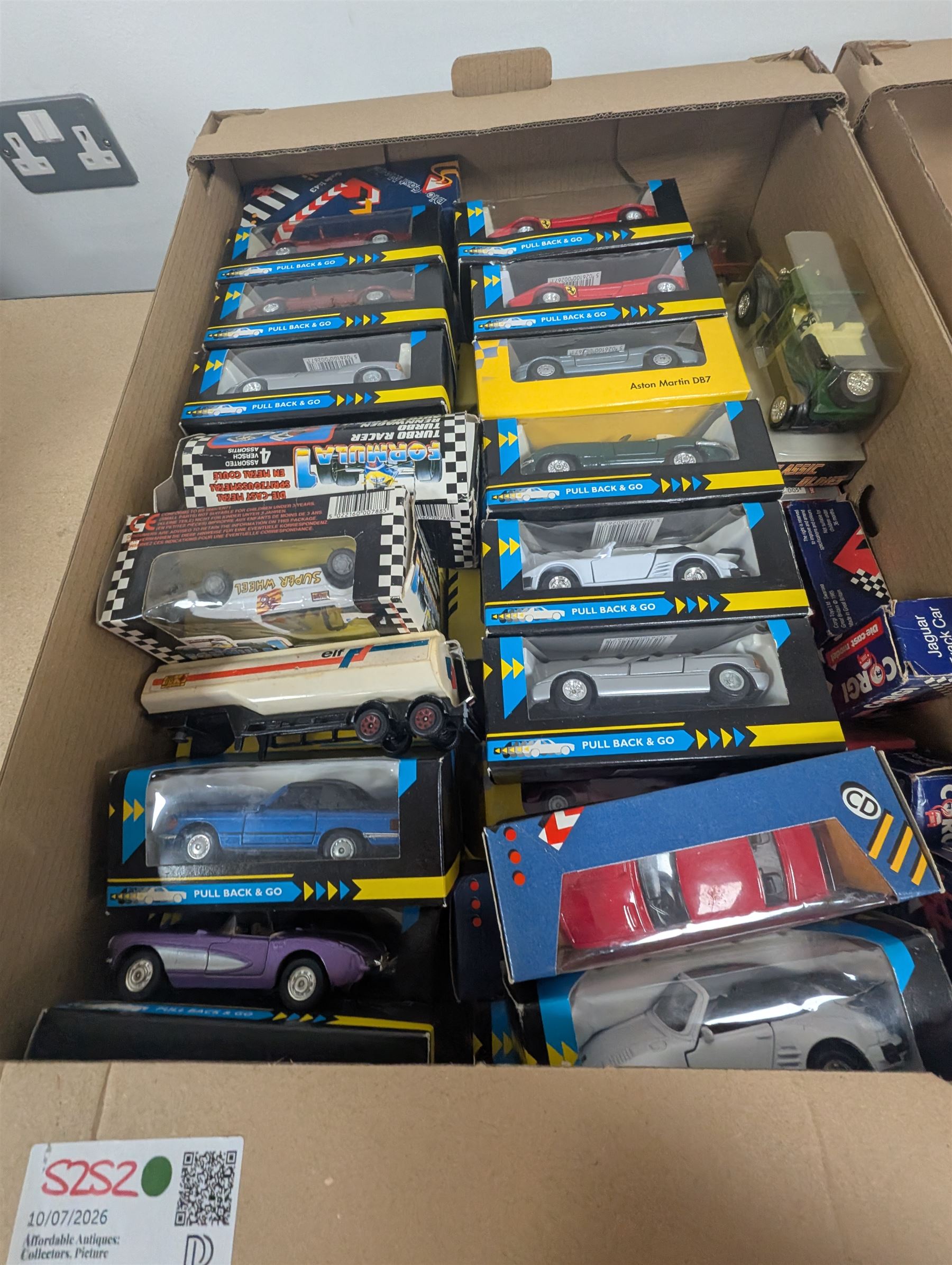 Collection of 1:43 scale diecast model vehicles, mostly Bburago, all boxed, in three boxes
