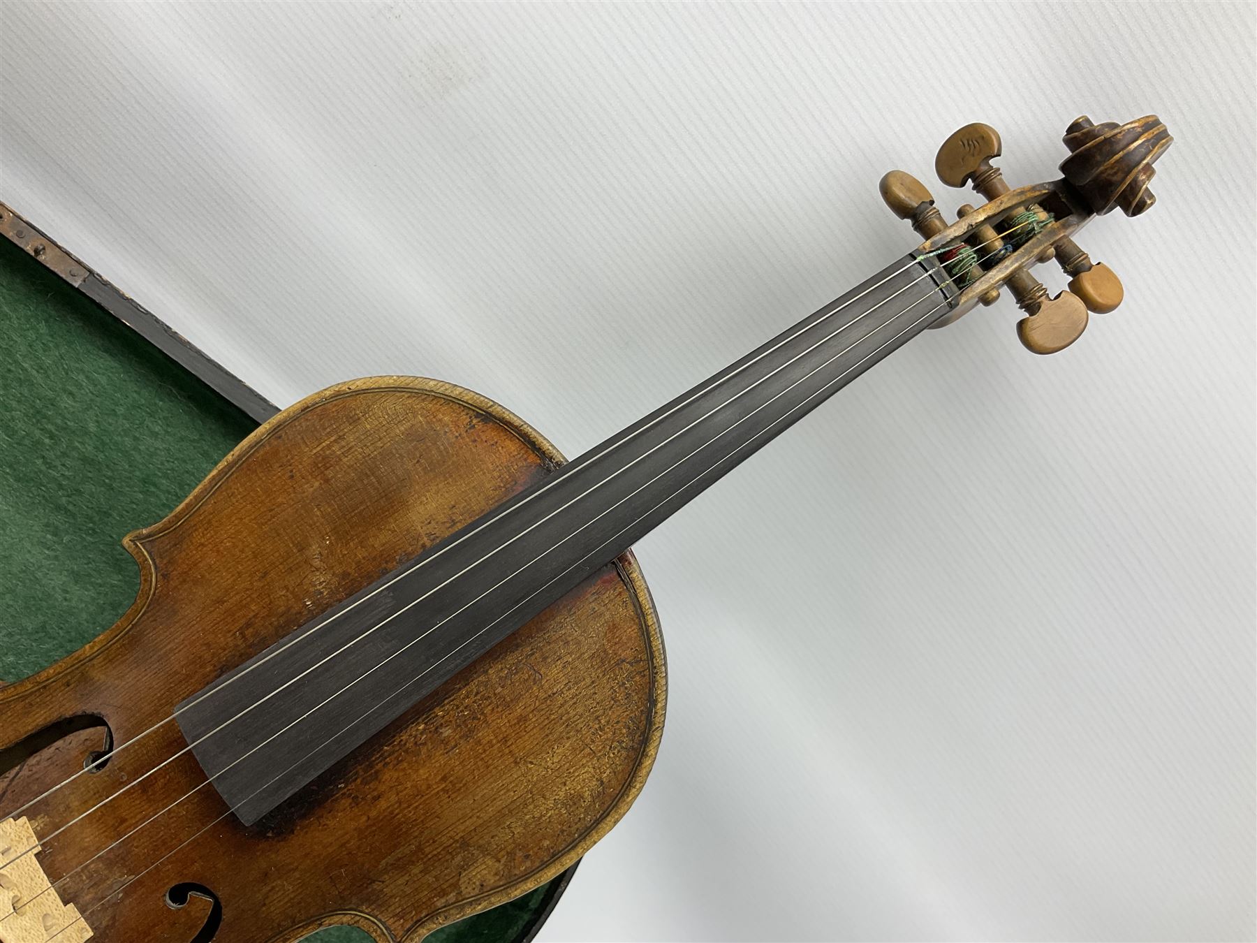 Late 19th century German violin with 36cm two-piece maple back and ribs and spruce top; bears label for 'Thomas Jacklin Violin Maker & Repairer Hull 1879'; 60cm overall; in ebonised wooden coffin case.