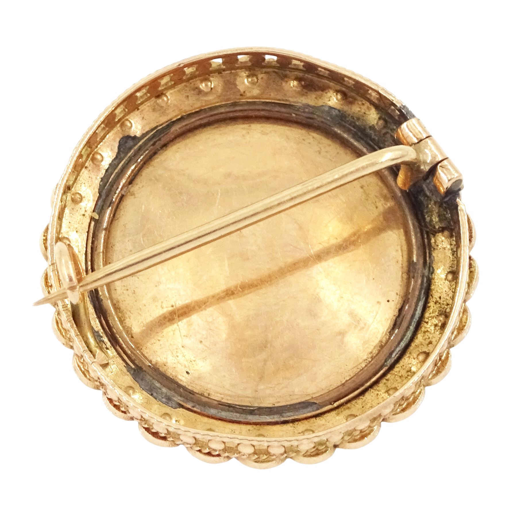 19th century gold pearl portrait brooch, set with a circular miniature of a woman in 18th century dress on ivory, under a glazed panel, with split pearl surround, to a pierced scalloped gallery. This lot has been registered for sale under Section 10 of the APHA Ivory Act