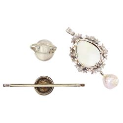 19th/ early 20th century silver portrait miniature jewellery including a pearl set pendant painted with a cherub, a ring painted with a young girl wearing a bonnet and brooch with seed pearl surround, all on ivory. This lot has been registered for sale under Section 10 of the APHA Ivory Act