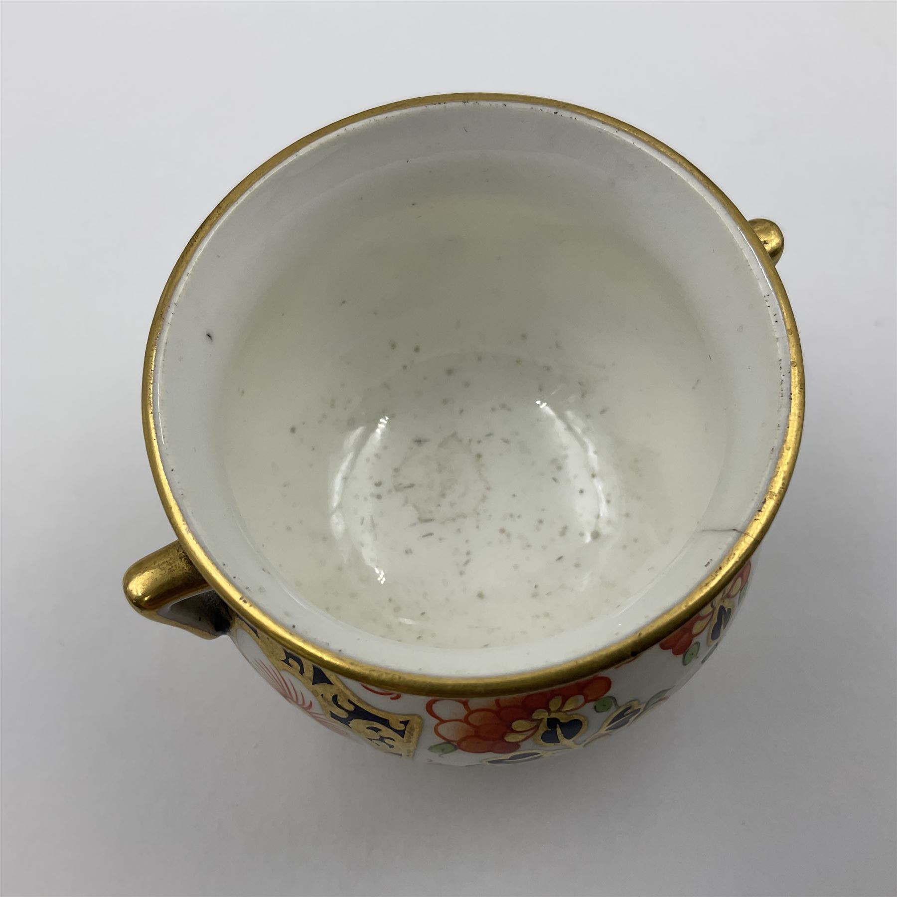 Group of Crown Derby and Royal Crown Derby Imari pattern miniatures, including mid 19th century Stevenson and Hancock cauldron, with painted mark beneath, H5.5cm, a near pair of early Royal Crown Derby scuttles, decorated in the 6299 pattern, each with printed and painted marks beneath including illustration date codes for 1913 and 1922, tallest 6.5cm, and a further early 20th century Royal Crown Derby scuttle, decorated in the 6299 pattern, with printed and painted marks beneath including illustration date code for 1922, H5.5cm, (4)
