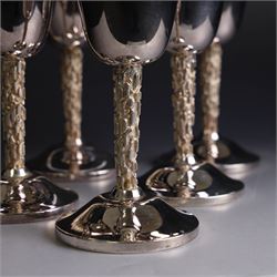 Eight silver goblets, comprising set of six, each plain fluted bowl with gilt interior, upon bark effect stem and domed circular foot, and a pair of very similar examples boxed with large hallmarks to bowls, hallmarked Pinder Brothers, Sheffield 1970 and Sheffield 1976, H14cm