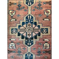 Persian Zanjan rug, red ground field decorated with three linked medallions, three band border with small repeating motifs