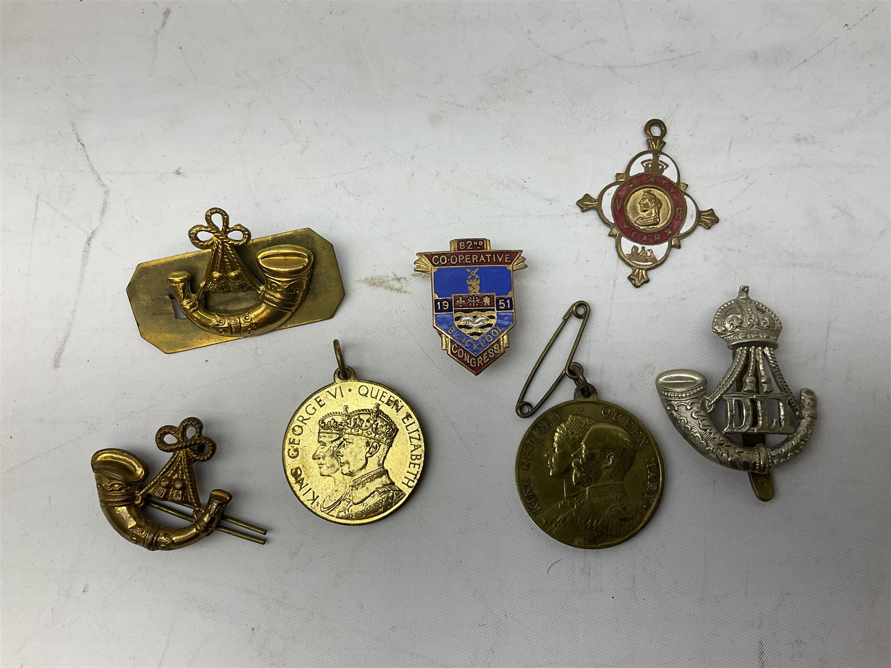 WW1 pair of medals comprising British War Medal and Victory Medal awarded to 24085 Sjt. J. Hazle Durh. L.I.; together with Durham Light Infantry cap and collar badges, shoulder titles, buttons etc; various royalty commemorative medallions etc