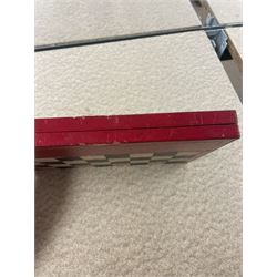 19th century walnut and brass bound games compendium box, painted to enhance the grain, of rectangular form, the hinged opening cover with rounded sides, central brass cartouche with engraved lion crest, and brass riveted straps, opening to reveal a red leather and blue silk lined compartmented interior, with fold-down games board, and lift-out tray containing playing cards, ebony turned dice towers, white and red stained bone draughts, and chess pieces, ivory dice, and ivory and ebony whist markers, and brass bezique board, cribbage board and markers, H15cm W32cm D24cm
This lot has been registered for sale under Section 10 of the APHA Ivory Act