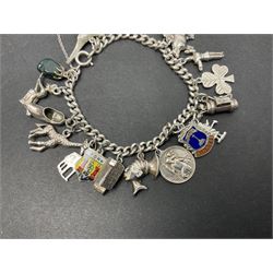 Silver charm bracelet, with eighteen charms, including cottage, shamrock, golf bag, giraffe, cow and witch, etc 