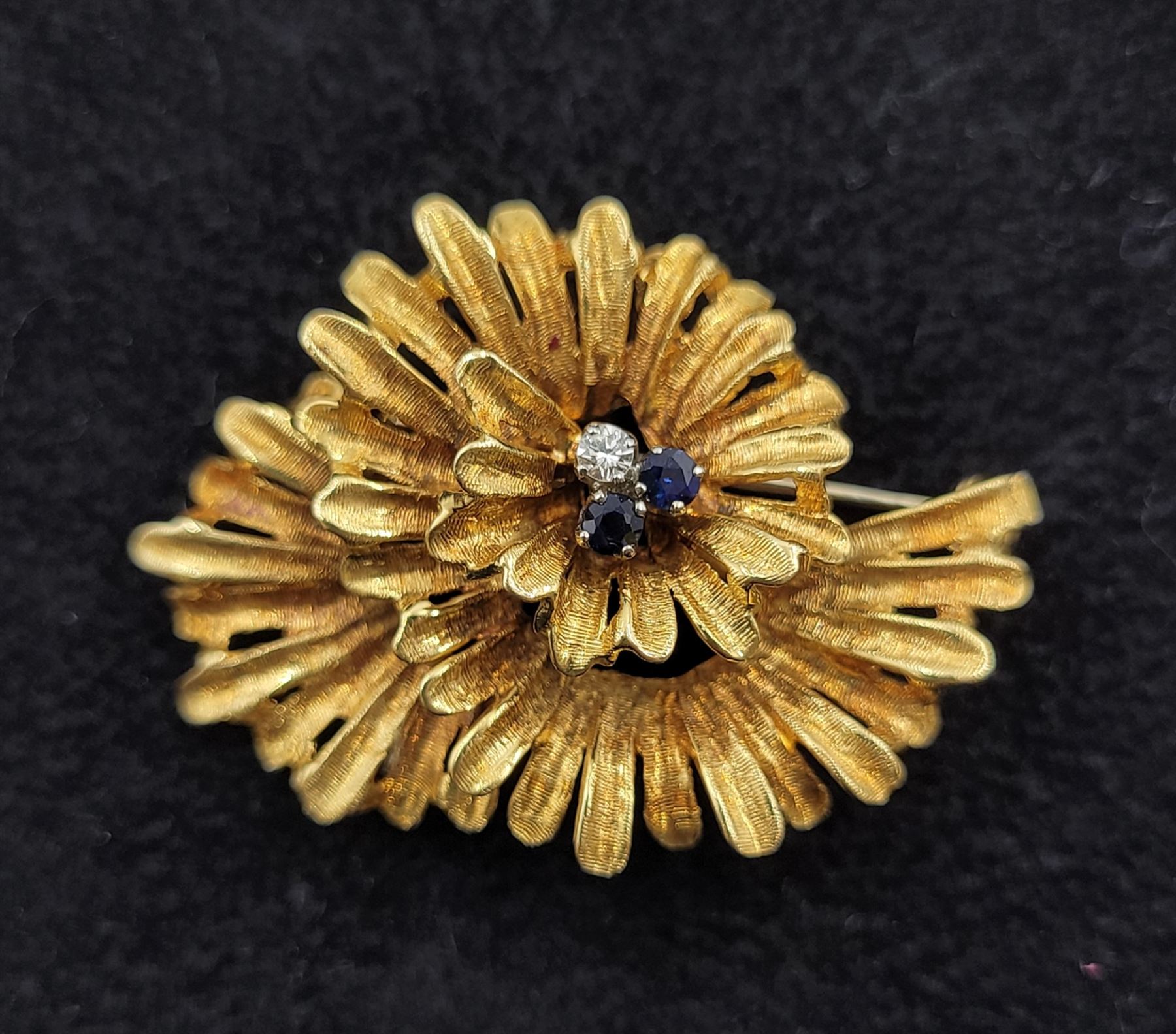 18ct gold three stone diamond and sapphire stylised flower brooch, London import mark 1969