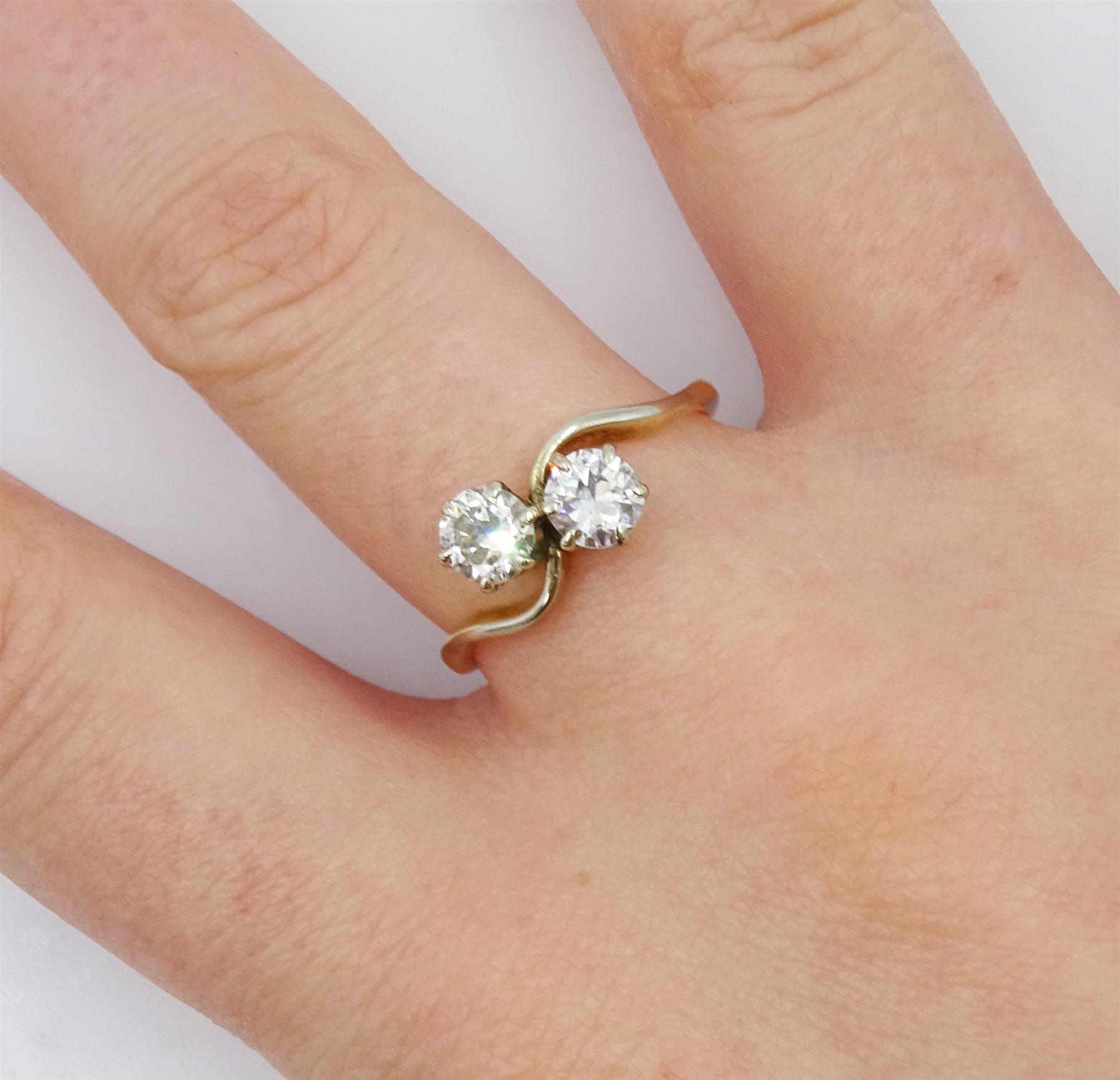 18ct gold two stone round brilliant cut diamond crossover ring, stamped, total diamond weight approx 0.75 carat