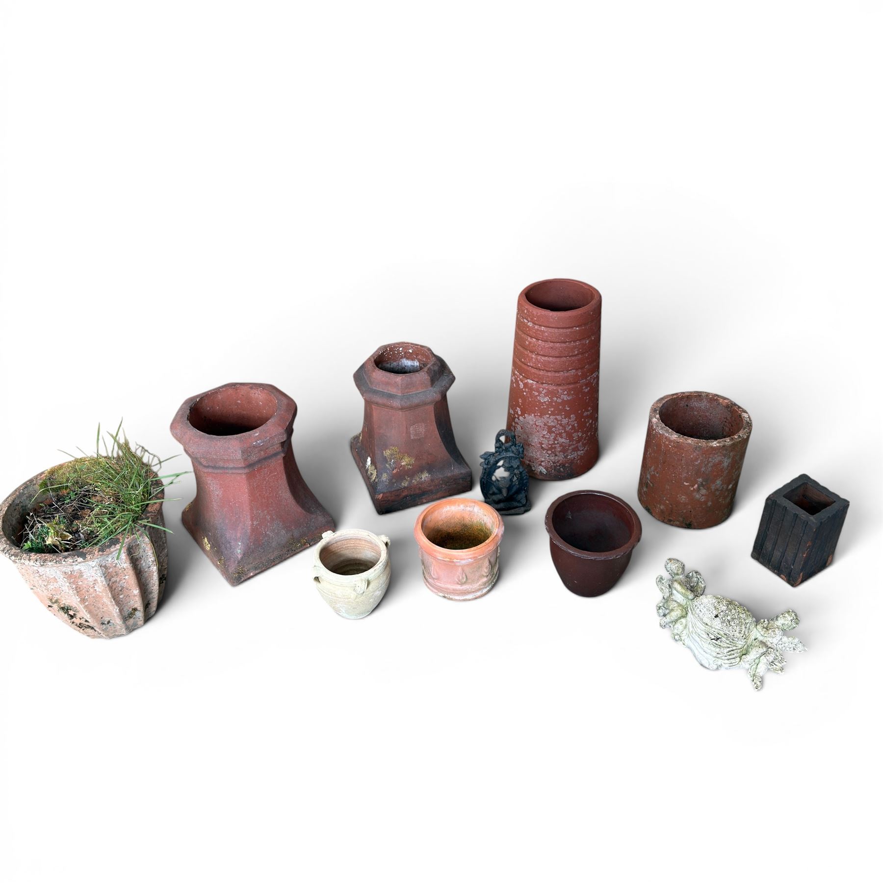 Two Victorian terracotta octagonal squat chimney pots, three other pots, terracotta planter, three small planters, cast iron fox door stop and a cherub wall pocket