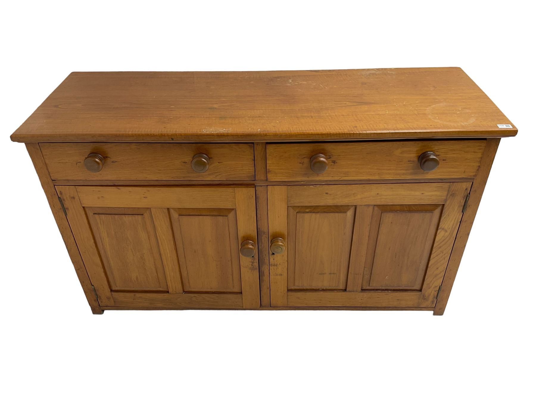 JAS Brister & Co Ld - Mid-20th century teak sideboard, fitted with two drawers over two panelled cupboards, stamped 'JAS. Brister & Co Ltd., Complete House Furniture, Port Elizabeth'