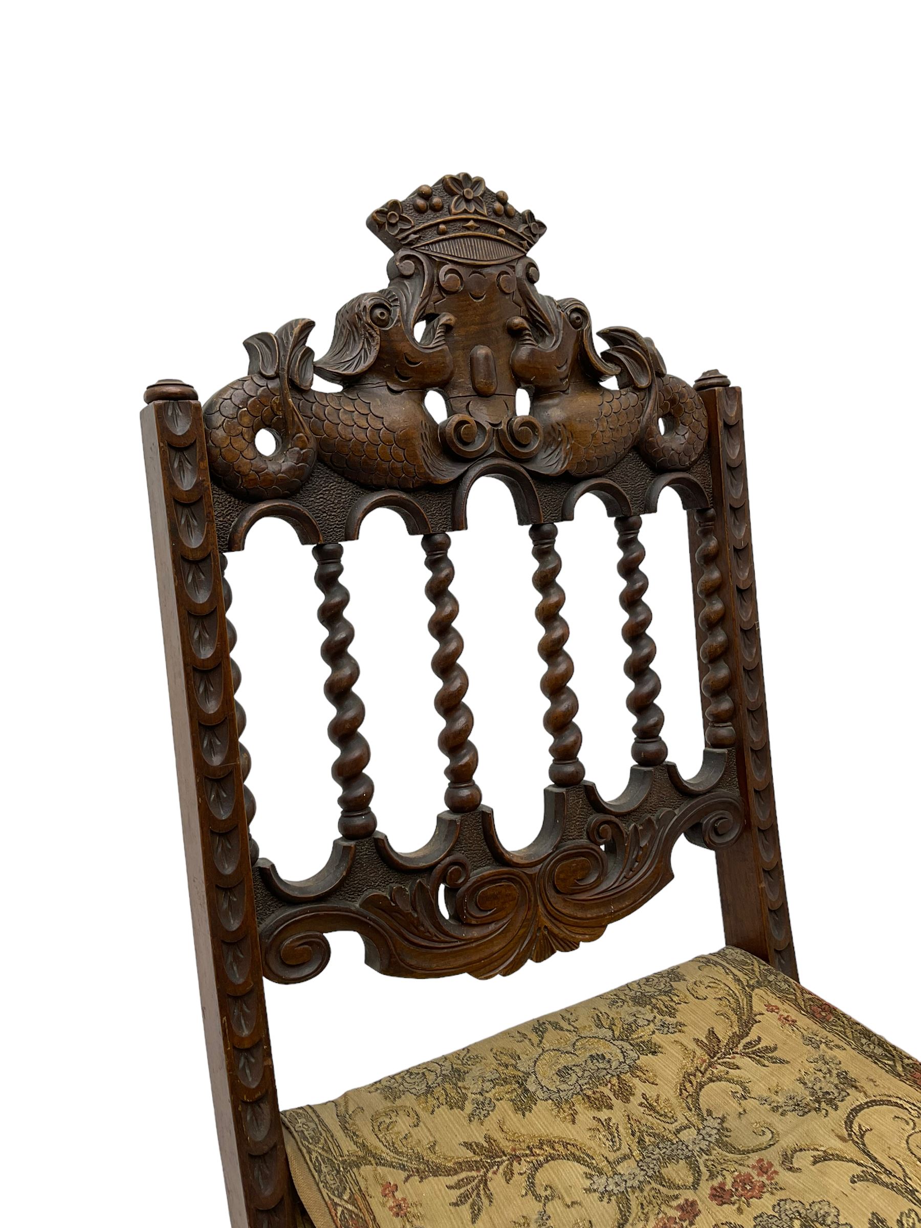 19th century carved mahogany folding chair, cresting rail carved with two stylised fish flanking a crown, spiral turned spindle supports over tapestry seat (W37cm H89); and another folding chair (W46cm H100cm)