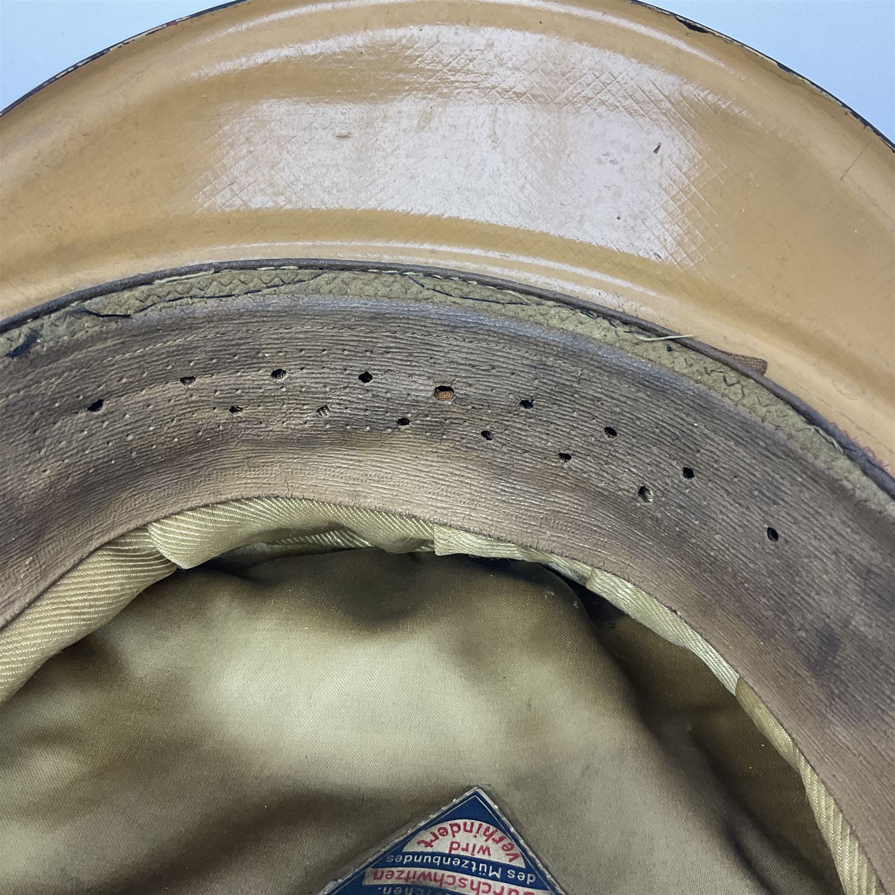 WW2 German Infantry Officer's visor cap with cloth insignia; labelled and stamped Offizier Kleiderkasse Berlin and Erel Stirnschutz