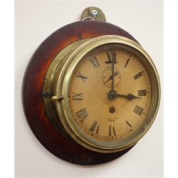  Smiths brass cased Bulkhead type clock, Roman dial with subsidiary seconds, on oak plaque, diam 18cm  
