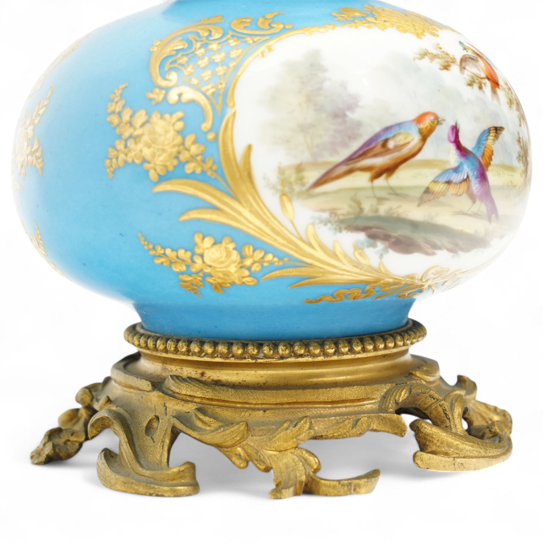 19th century French porcelain vase in the manner of Sevres, the reserves painted with birds within a landscape and floral bouquets, on a turquoise ground with gilt highlights, with ormolu style gilt metal collar and base, H26cm