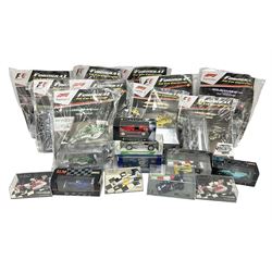 Panini Formula 1 The Car Collection - twelve die-cast models including ten in unopened packaging with periodical; all models in plastic display boxes; and eight other boxed die-cast models of racing cars by Corgi, Onyx, Classico, Minichamps etc (20)