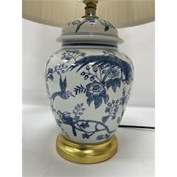 Table lamp of baluster form, decorated with exotic birds up fruiting trees, on gilt chrome pedestal, including shade H554cm