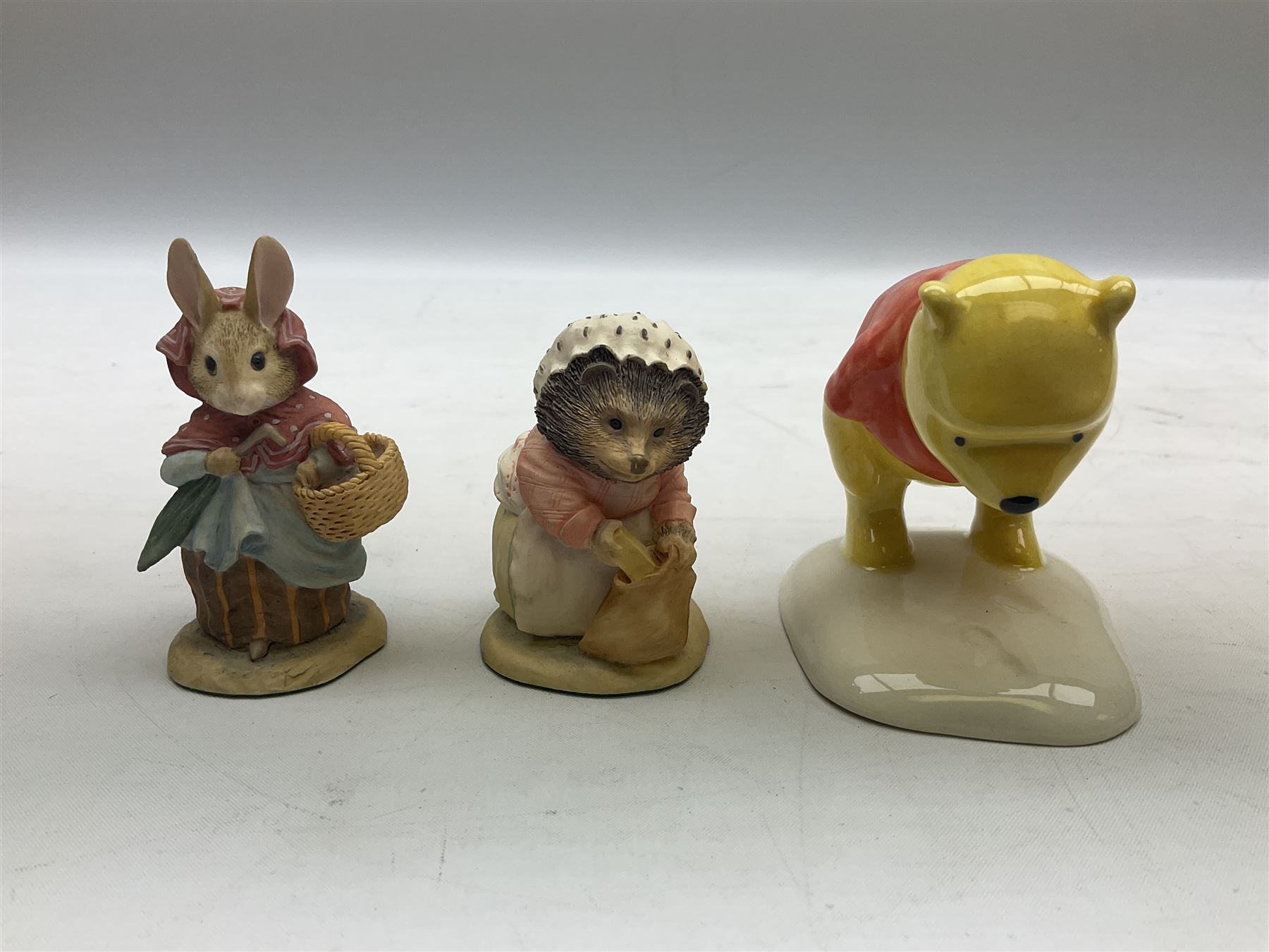 Two Royal Doulton Brambly Hedge figures comprising ‘Mrs Saltapple’ and ‘Poppy Eyebright’, Royal Albert Beatrix Potter ‘Foxy Whiskered Gentleman’ and ‘Mr Benjamin Bunny’, all with boxes, two Border Fine Arts Beatrix Potter figures comprising ‘Mrs Tiggywingle’ and ‘Mrs Rabbit’, Royal Doulton ‘Spike and Tyke’ and ‘Winnie Pooh and Footprints’ both with boxes, all marked beneath